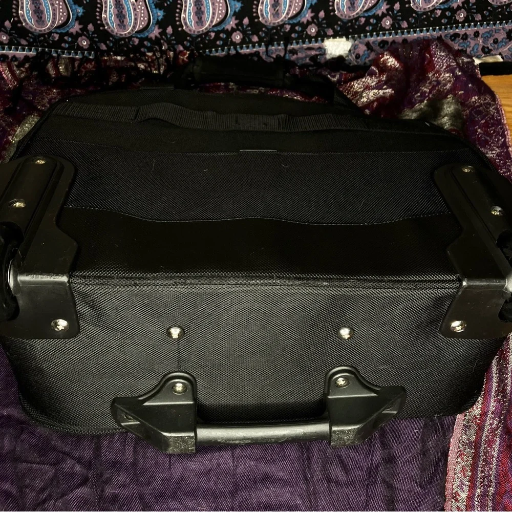Delsey rolling carry on luggage bag